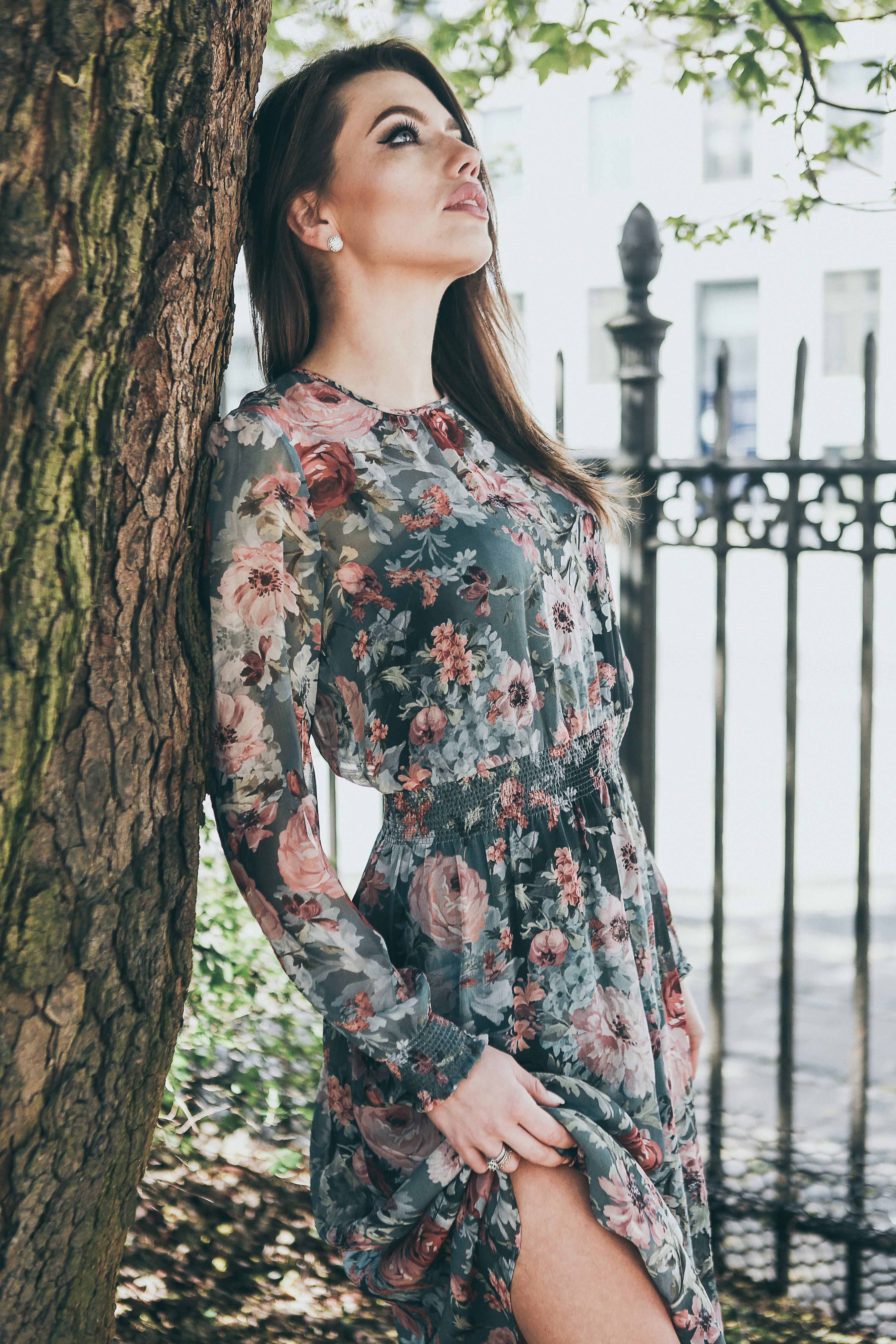 woman standing near the tree